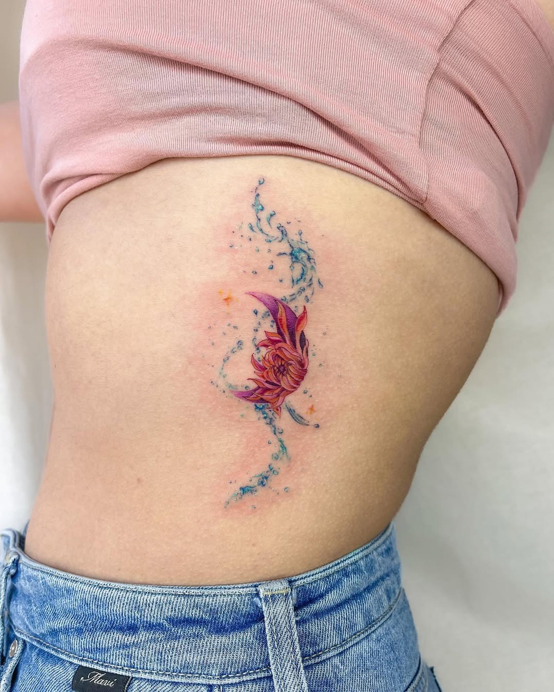 Vibrant aquatic-themed tattoo showcasing fluidity Tattoo Design