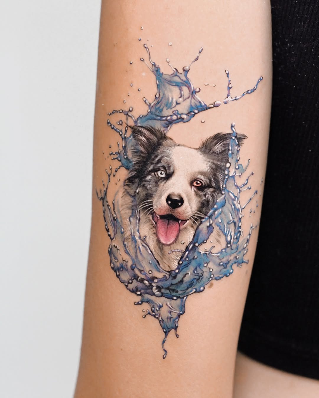 Vibrant dog portrait surrounded by water splashes Tattoo Design