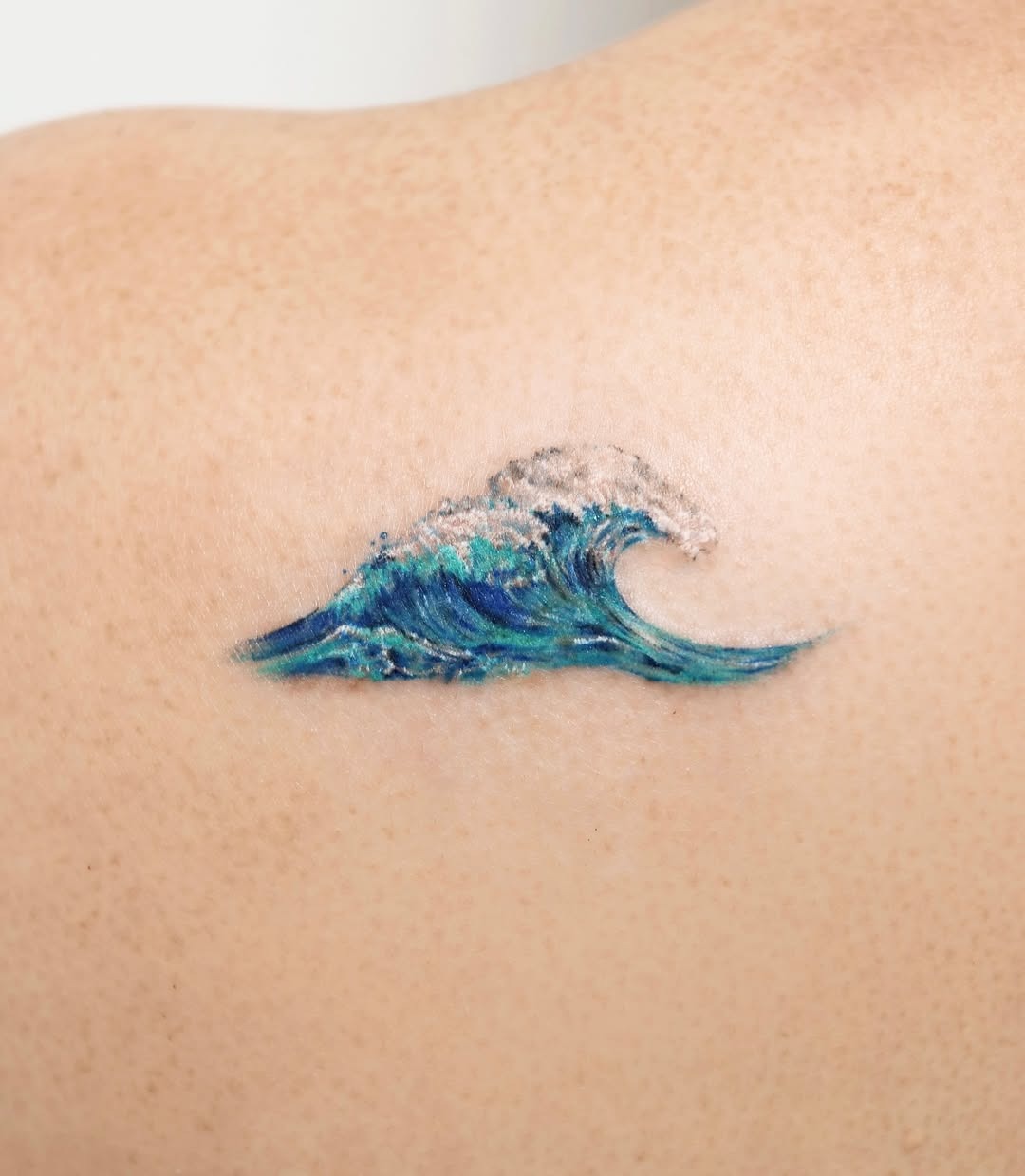 Vibrant wave tattoo with rich colors Tattoo Design