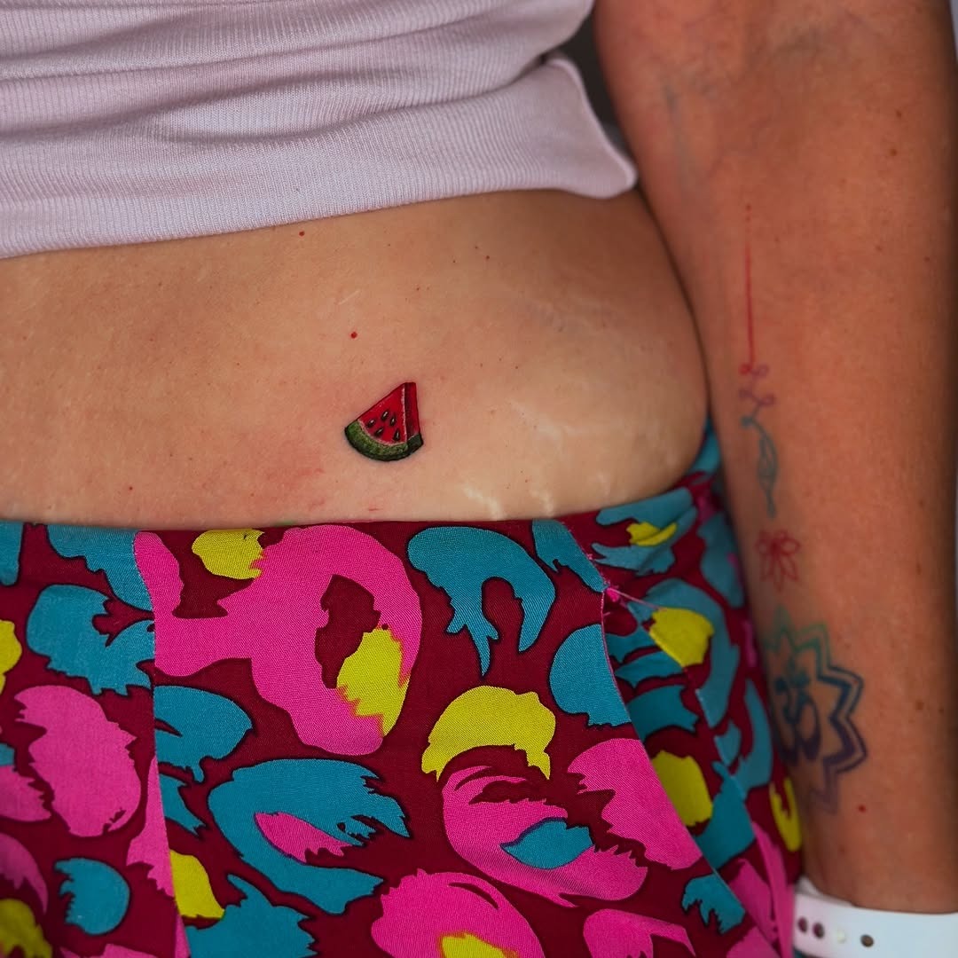 Brightly colored watermelon tattoo on the belly Tattoo Design