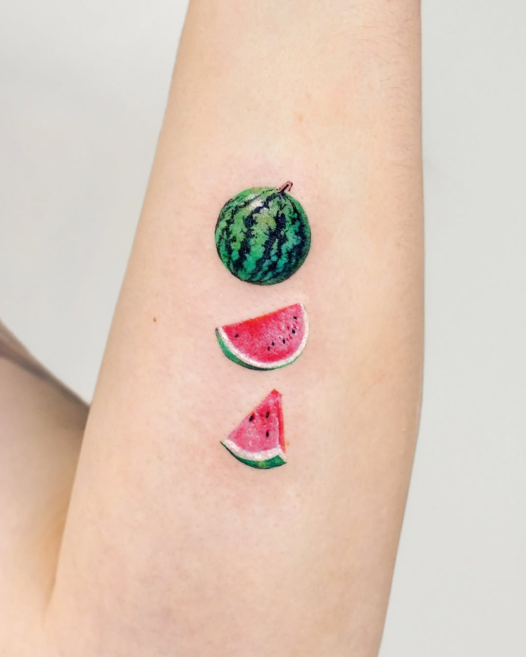 Charming watermelon slices tattoo design with a twist Tattoo Design