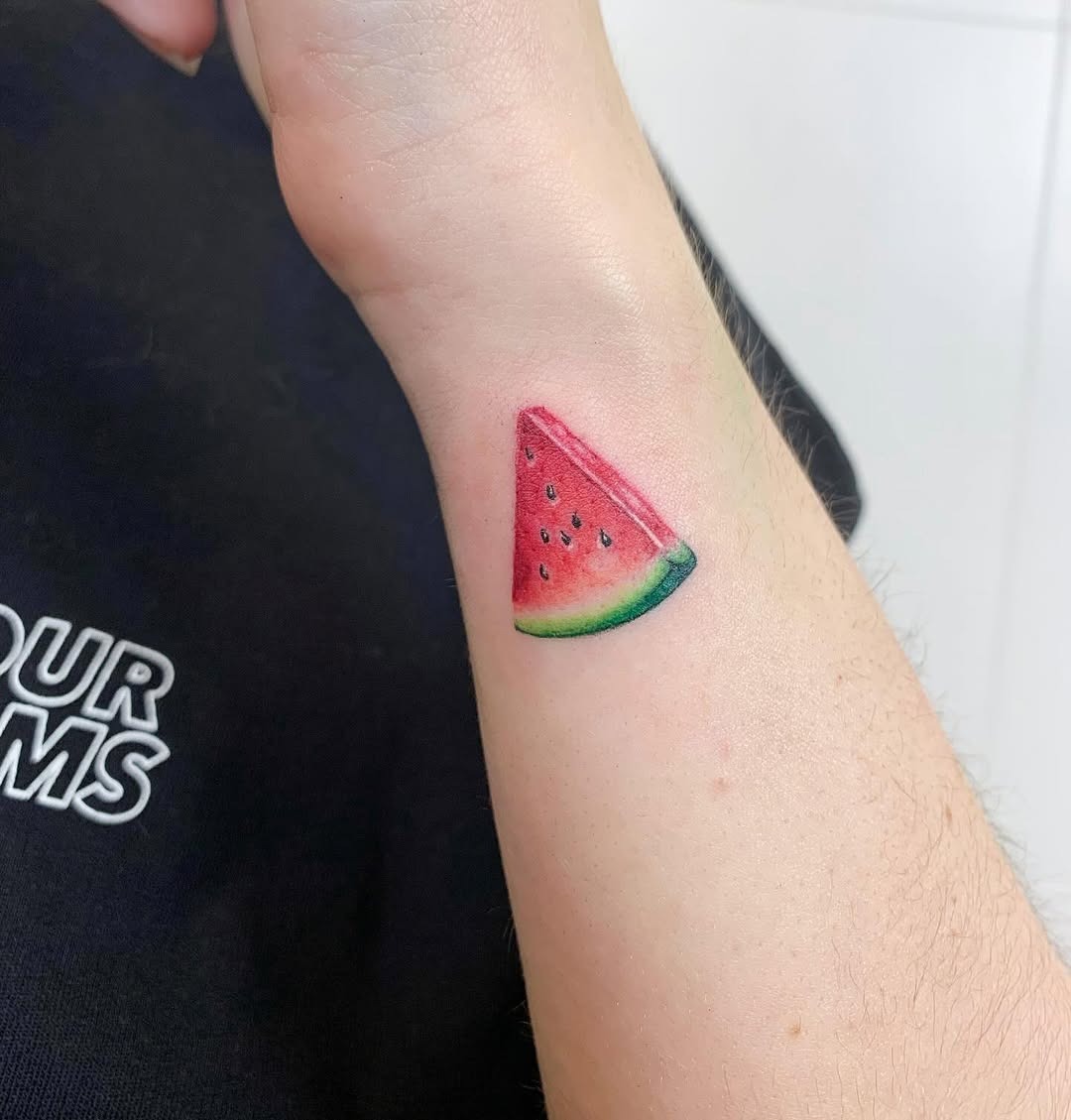 Colorful watermelon slice tattoo on the arm Tattoo Design