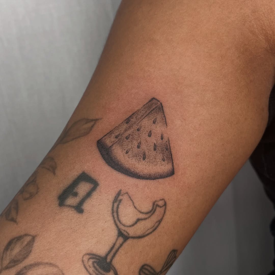 Fresh Watermelon Slice Tattoo in Negative Space Tattoo Design