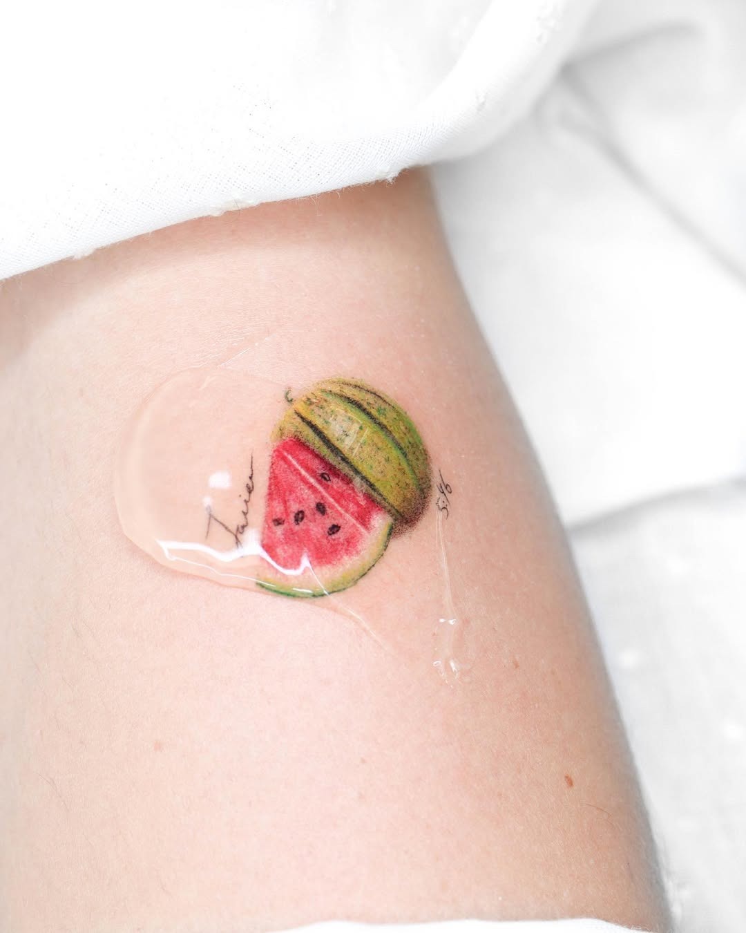 Vibrant and playful watermelon slice tattoo Tattoo Design