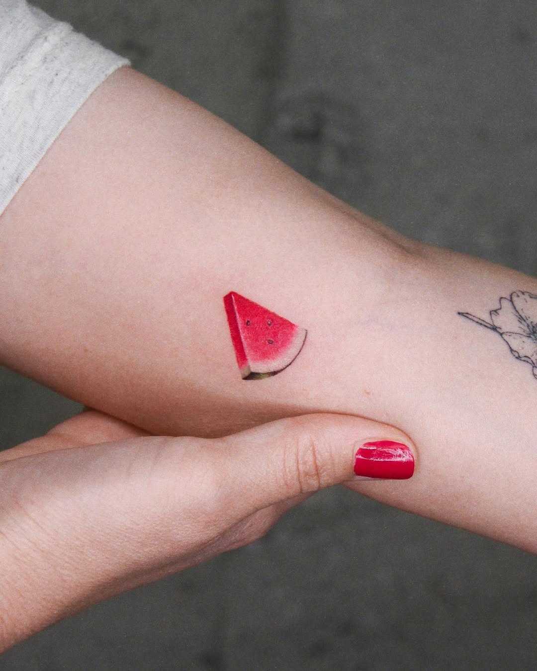 Vibrant Watermelon Slice Tattoo on Skin Tattoo Design