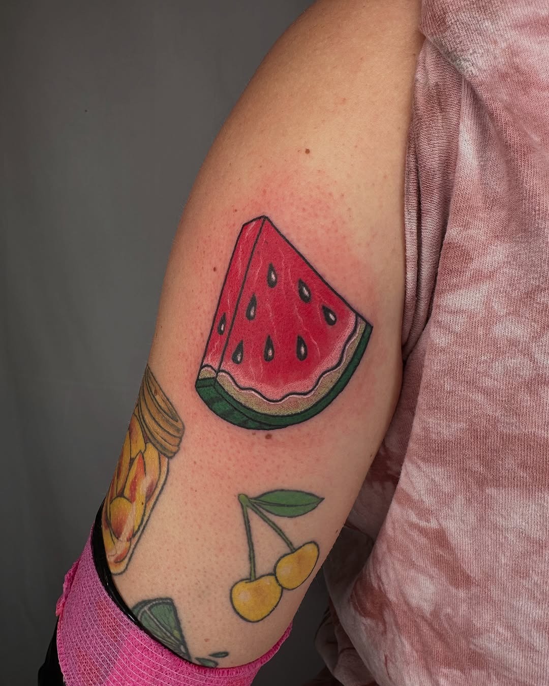 Vibrant watermelon slice tattoo on the arm Tattoo Design