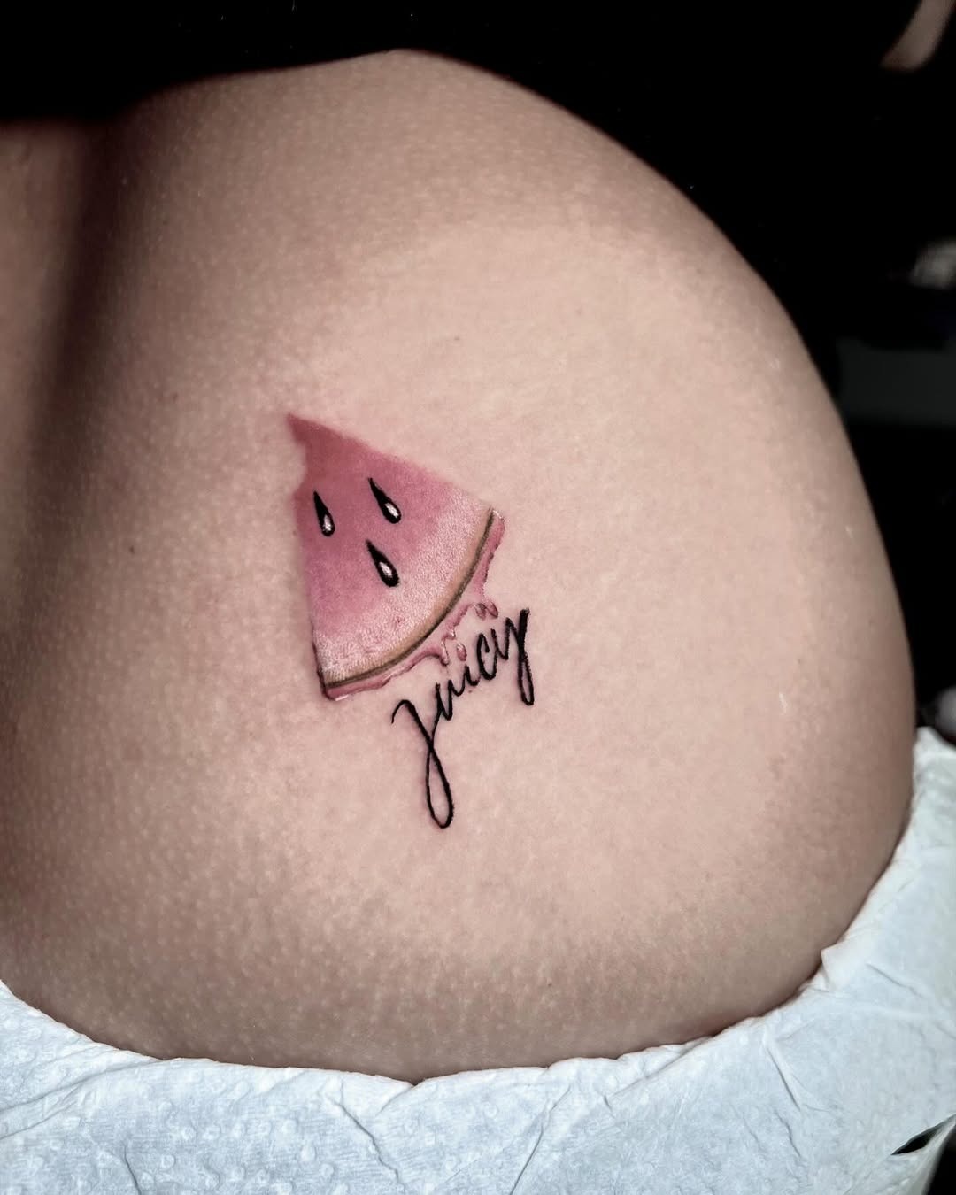 Vibrant watermelon slice tattoo with playful script Tattoo Design