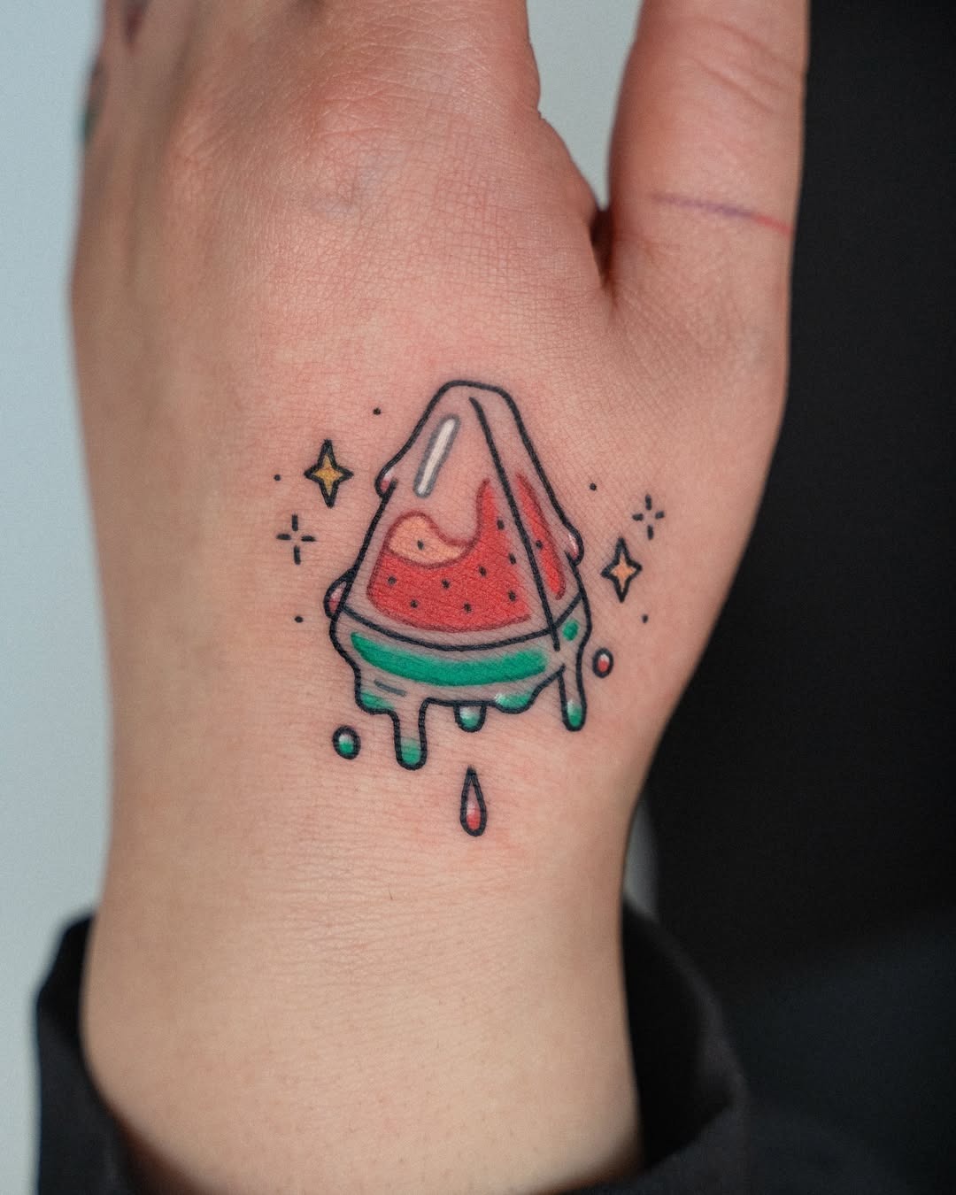 Vibrant watermelon tattoo on the hand Tattoo Design