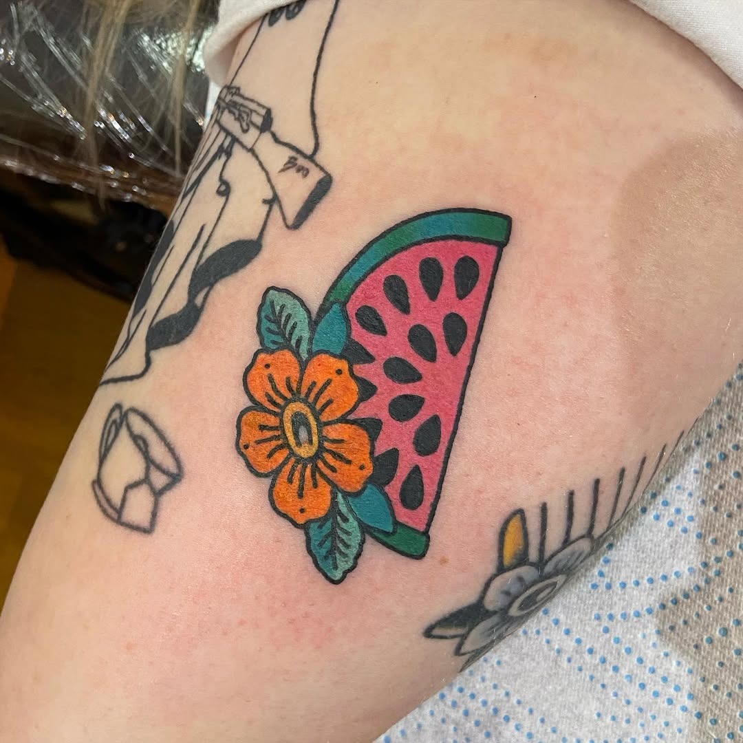 Vibrant watermelon tattoo with floral accents Tattoo Design