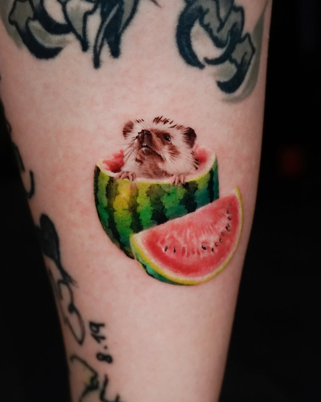Whimsical hedgehog nestled in vibrant watermelon tattoo Tattoo Design