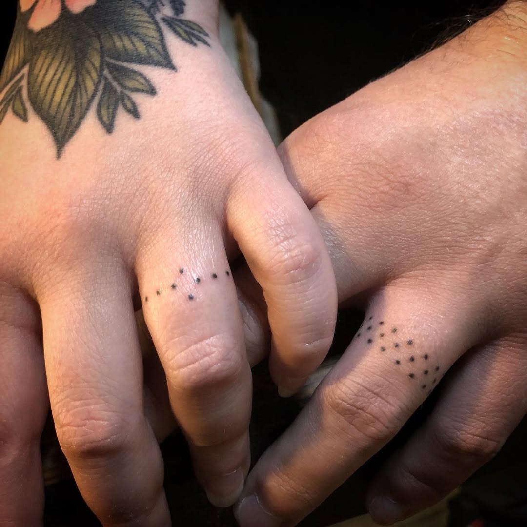 Minimalist dot pattern wedding ring tattoos Tattoo Design