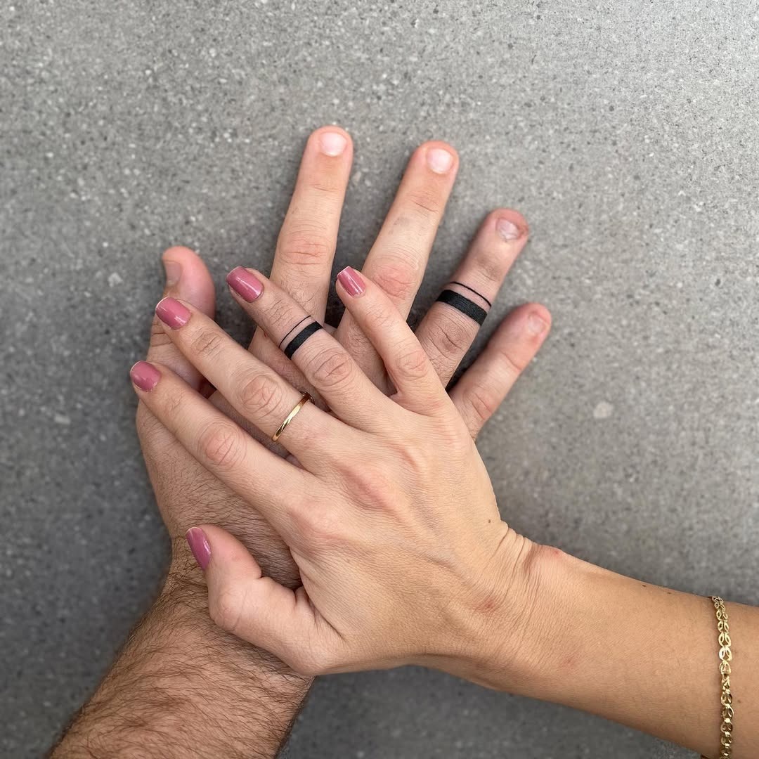 Stylish black ink wedding ring tattoo design Tattoo Design