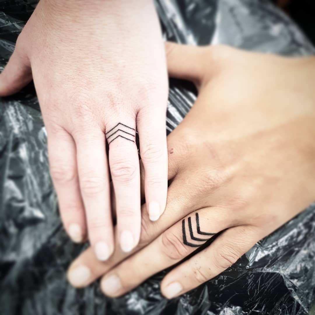 Stylish minimalist wedding ring tattoo designs Tattoo Design