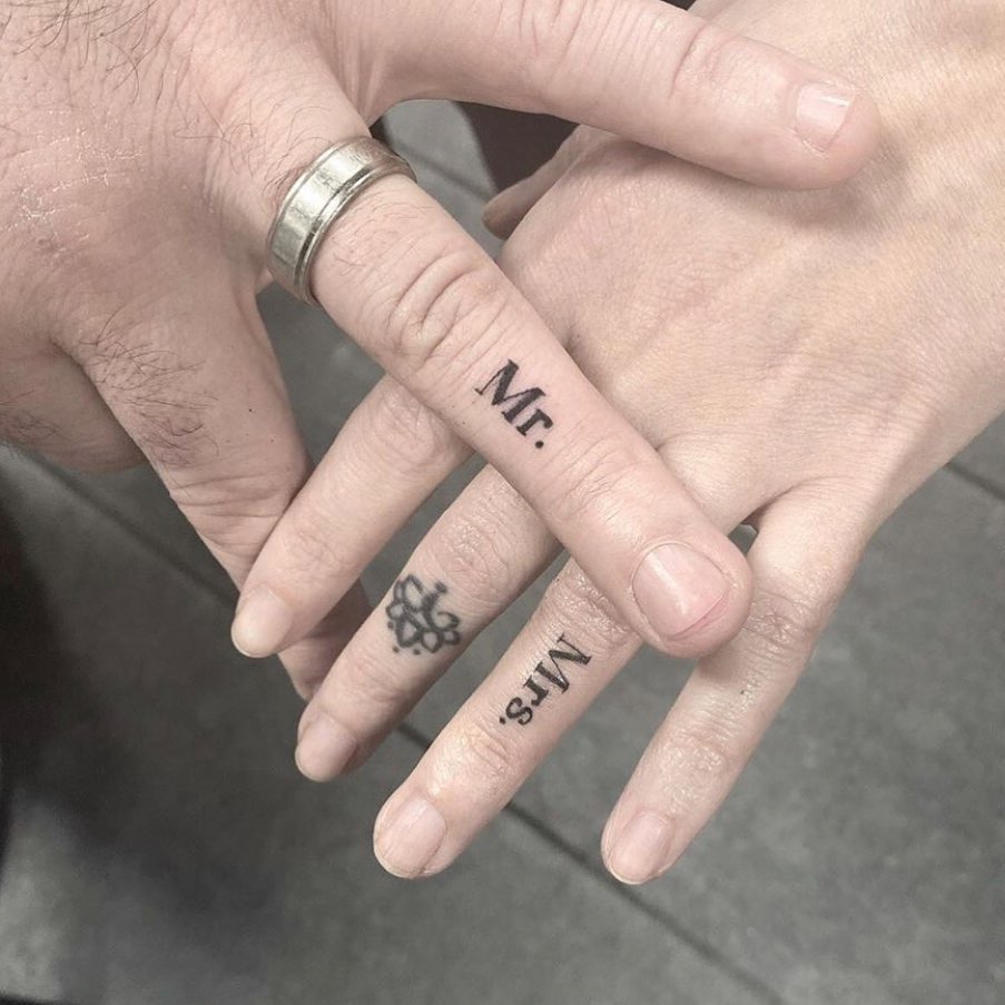 Unique Mr. and Mrs. Tattooed Love Symbols Tattoo Design