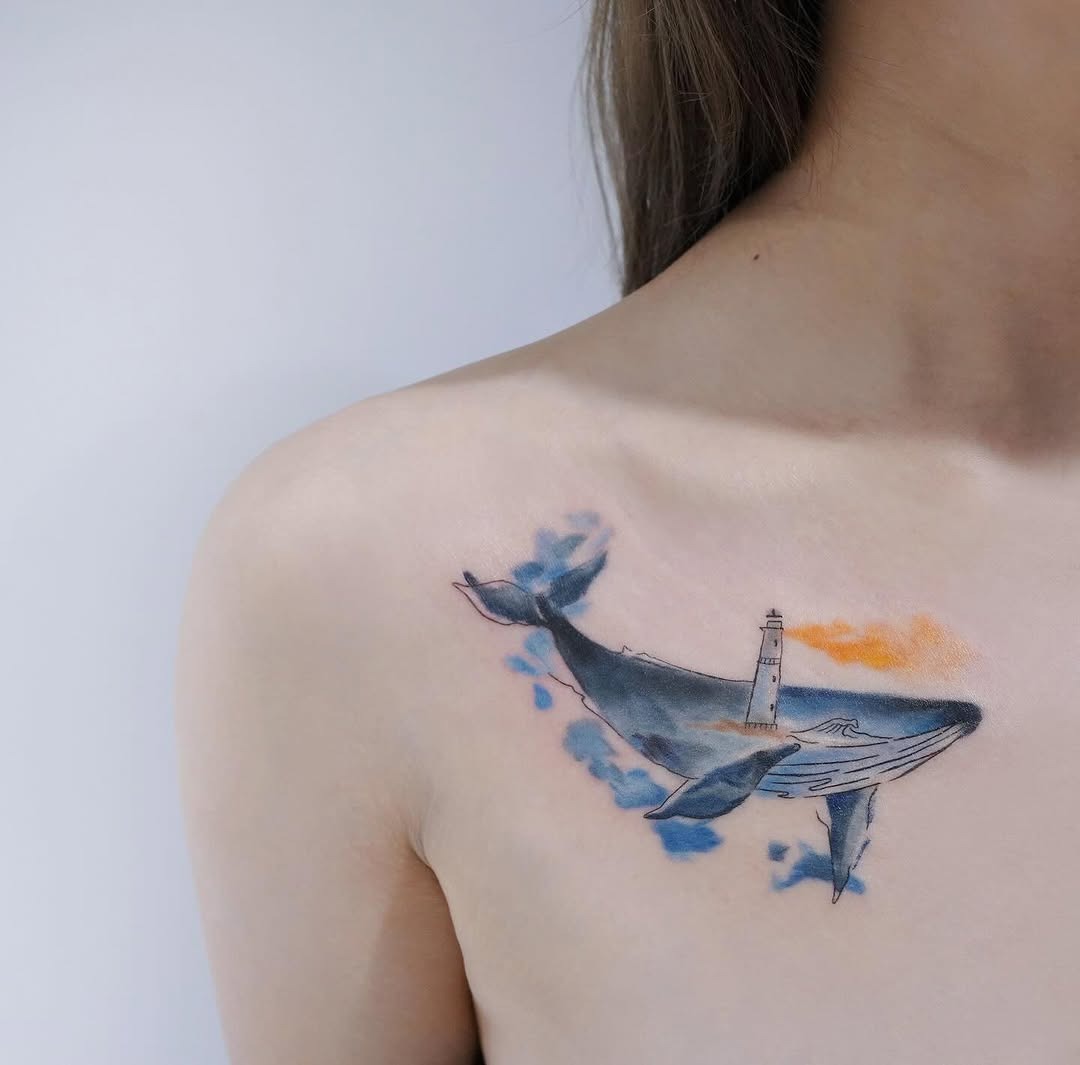 A vibrant whale tattoo with lighthouse detail Tattoo Design