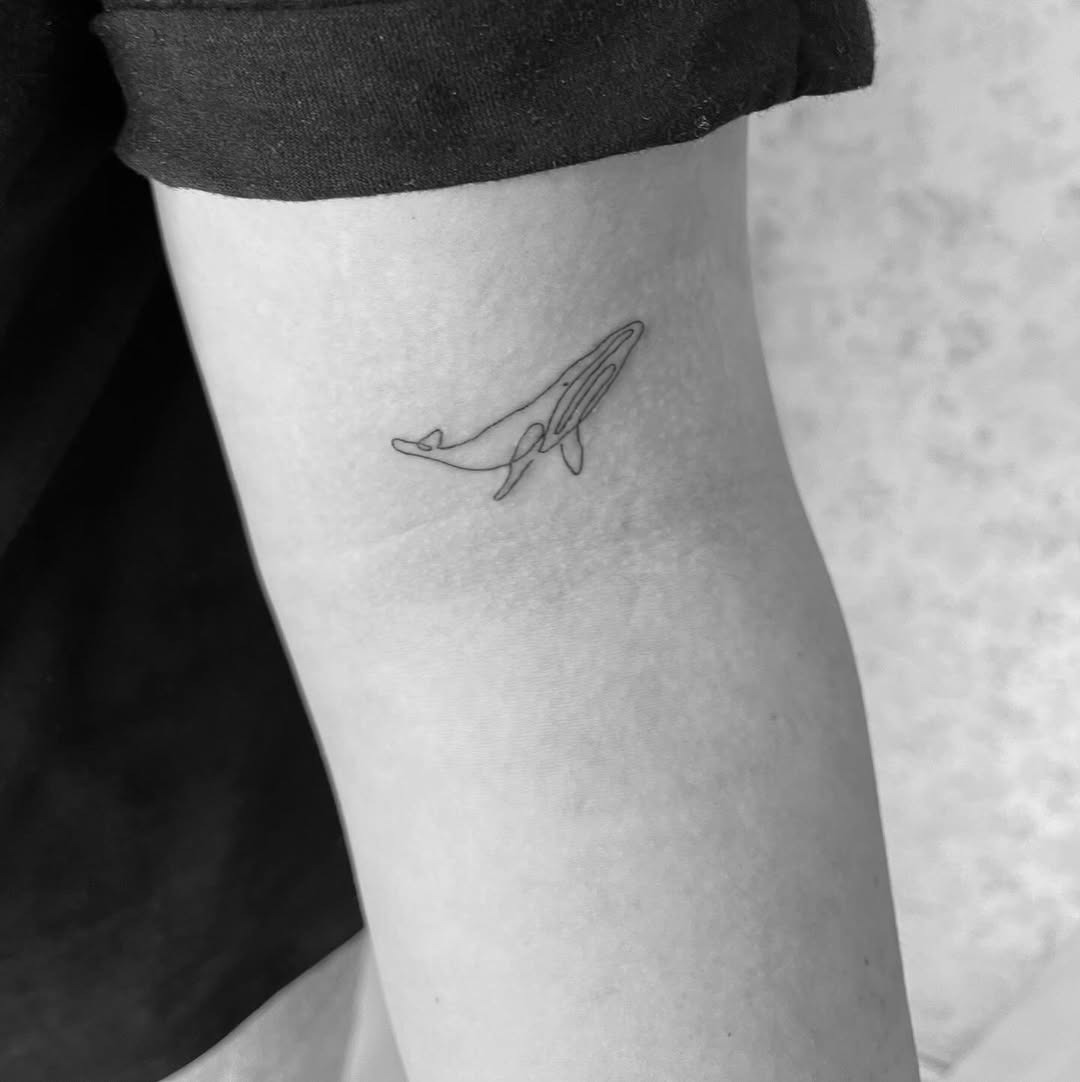 Chic Minimalist Whale Tattoo on Arm Tattoo Design