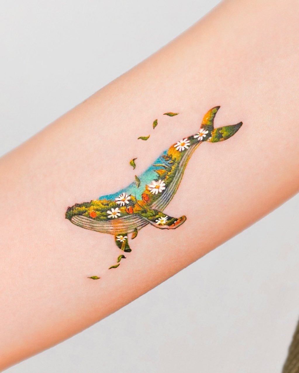 Colorful floral whale tattoo on the arm Tattoo Design