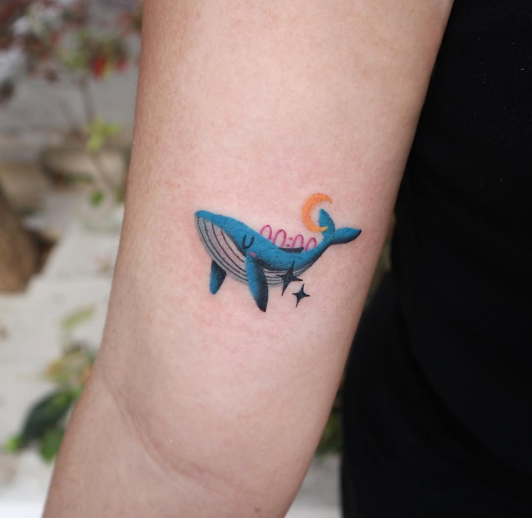 Colorful minimalist whale tattoo on the arm Tattoo Design