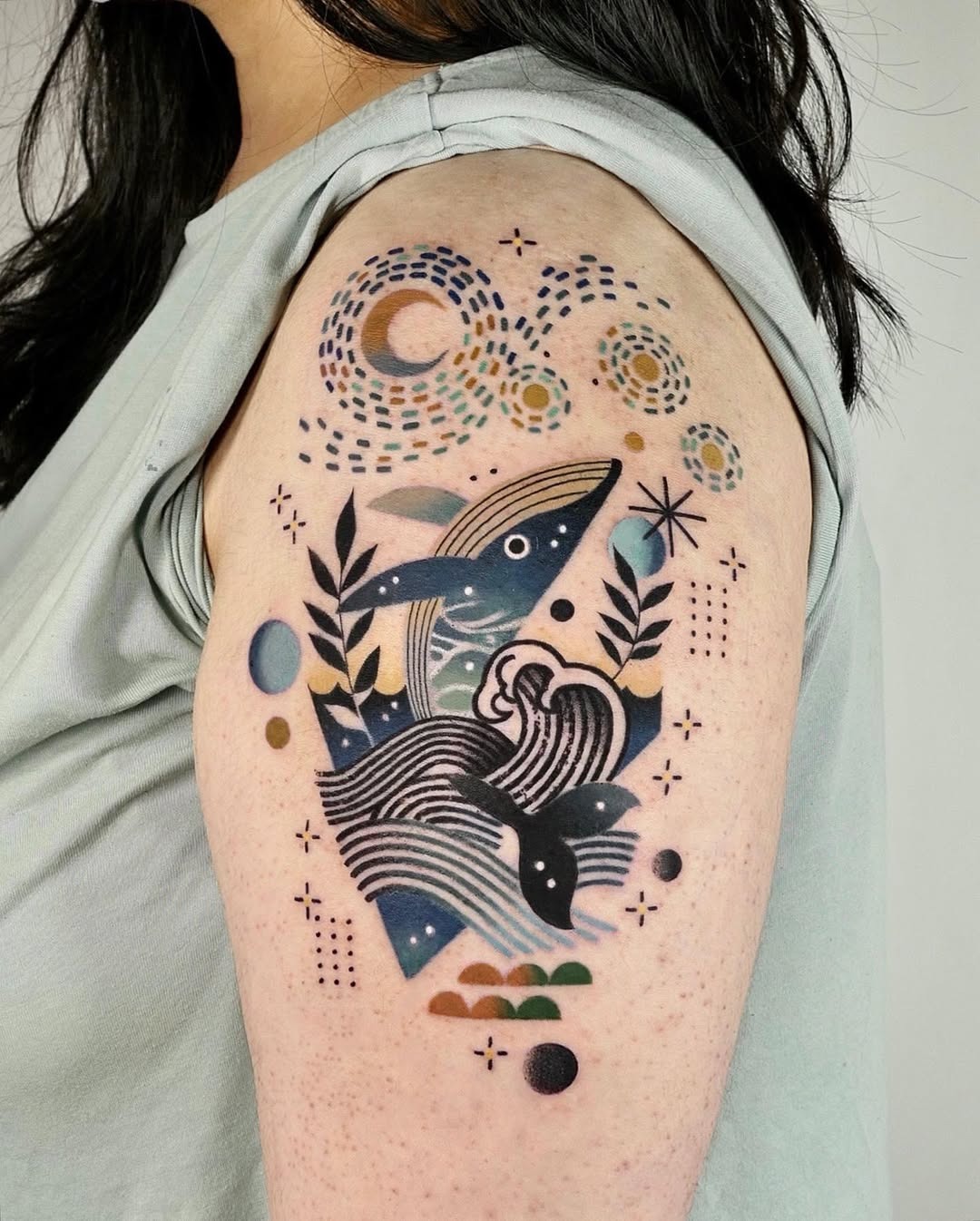 Colorful whale tattoo with cosmic elements Tattoo Design