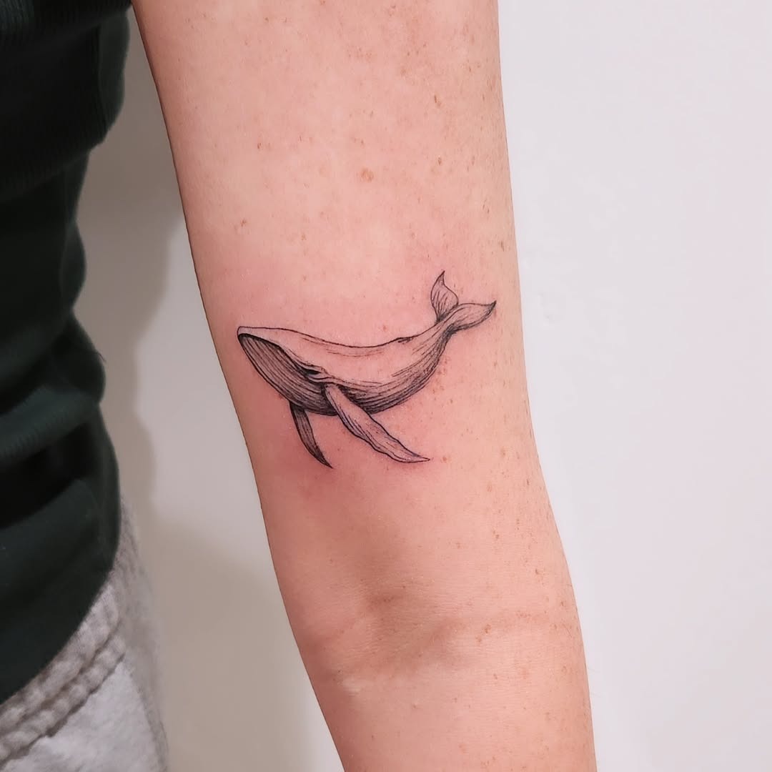 Elegant Fine Line Whale Tattoo on Arm Tattoo Design