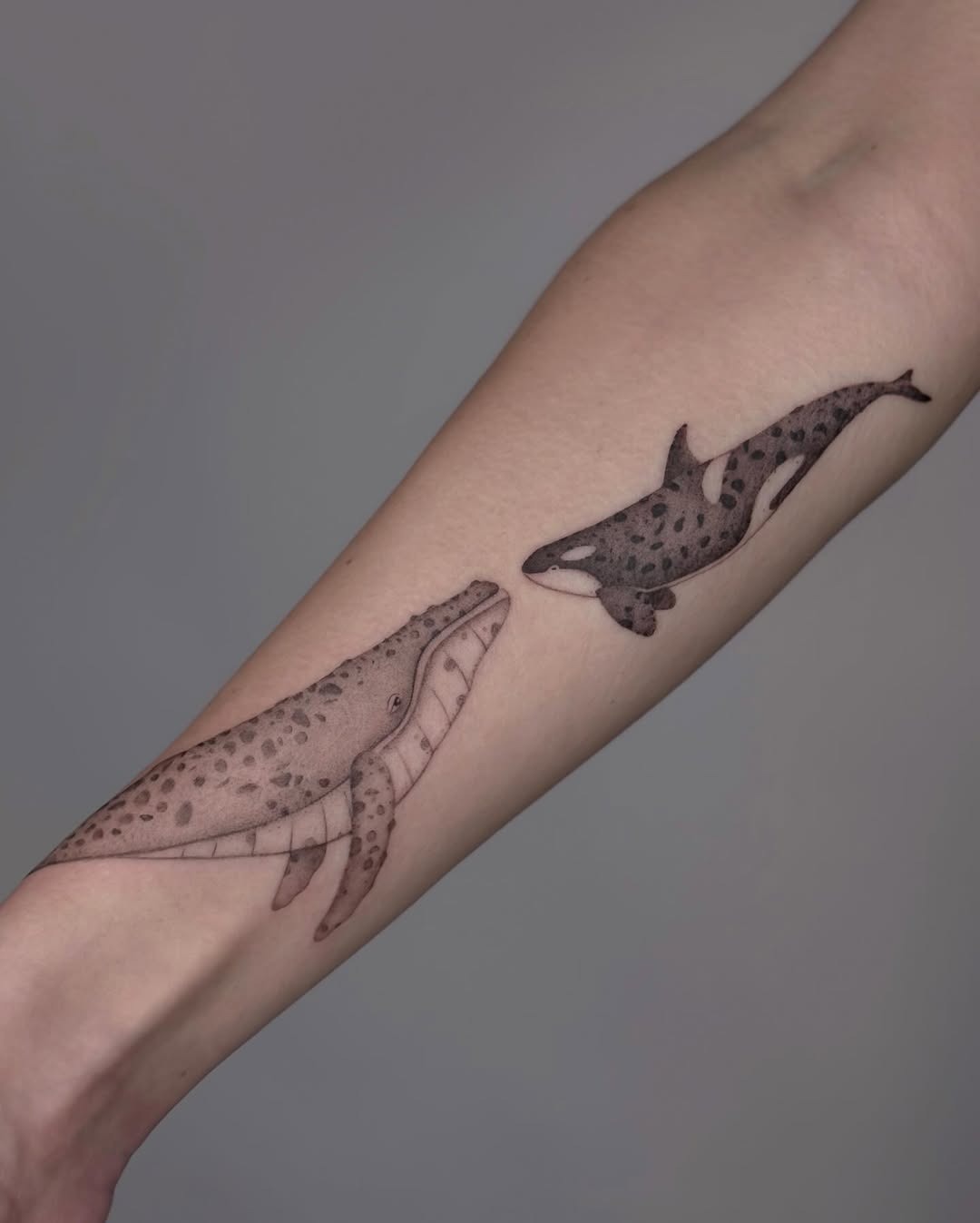 Elegant Minimalist Whale Tattoo for the Arm Tattoo Design