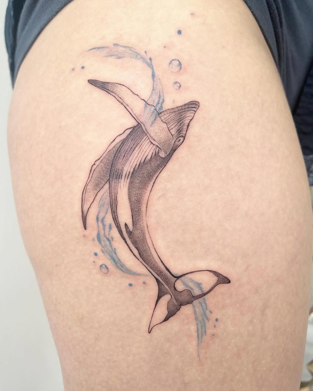 Elegant minimalist whale tattoo swimming gracefully Tattoo Design