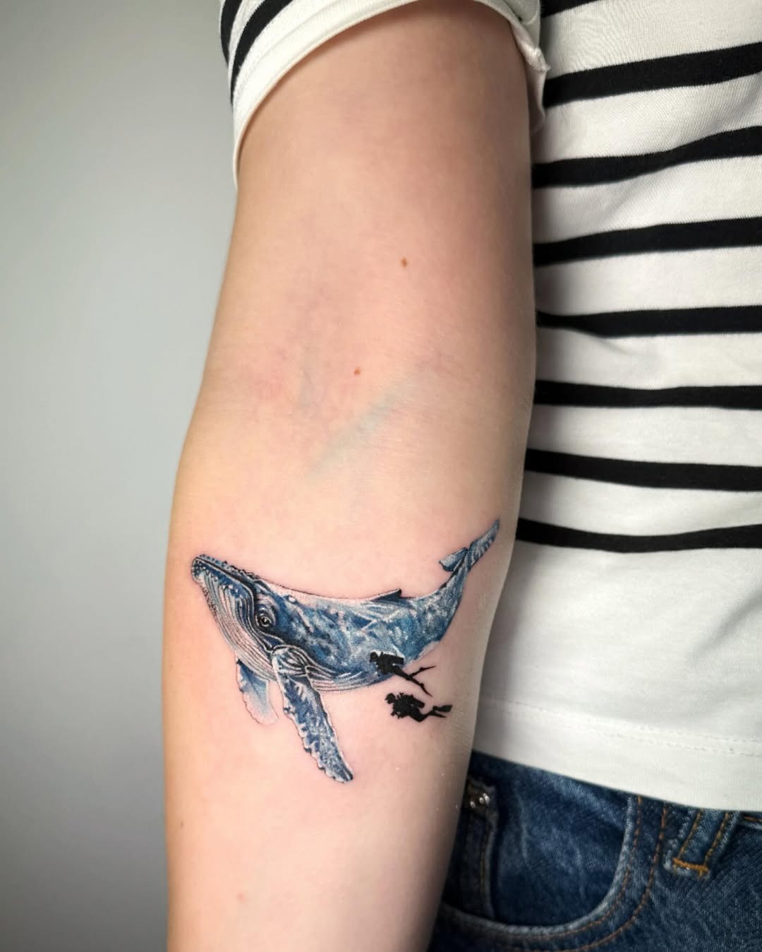 Elegant whale tattoo design on the arm Tattoo Design