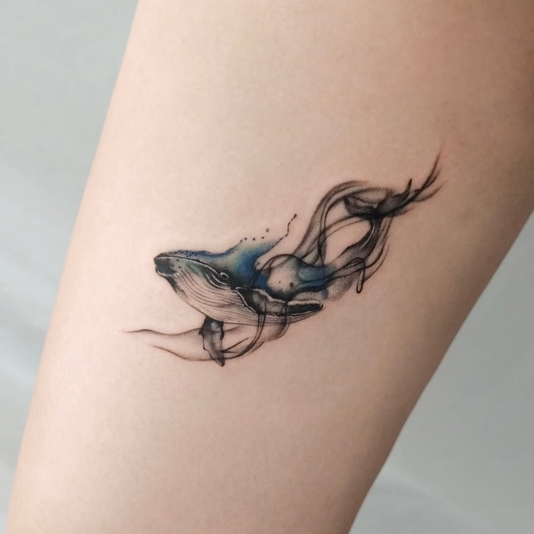 Elegant Whale Tattoo with Flowing Lines Tattoo Design