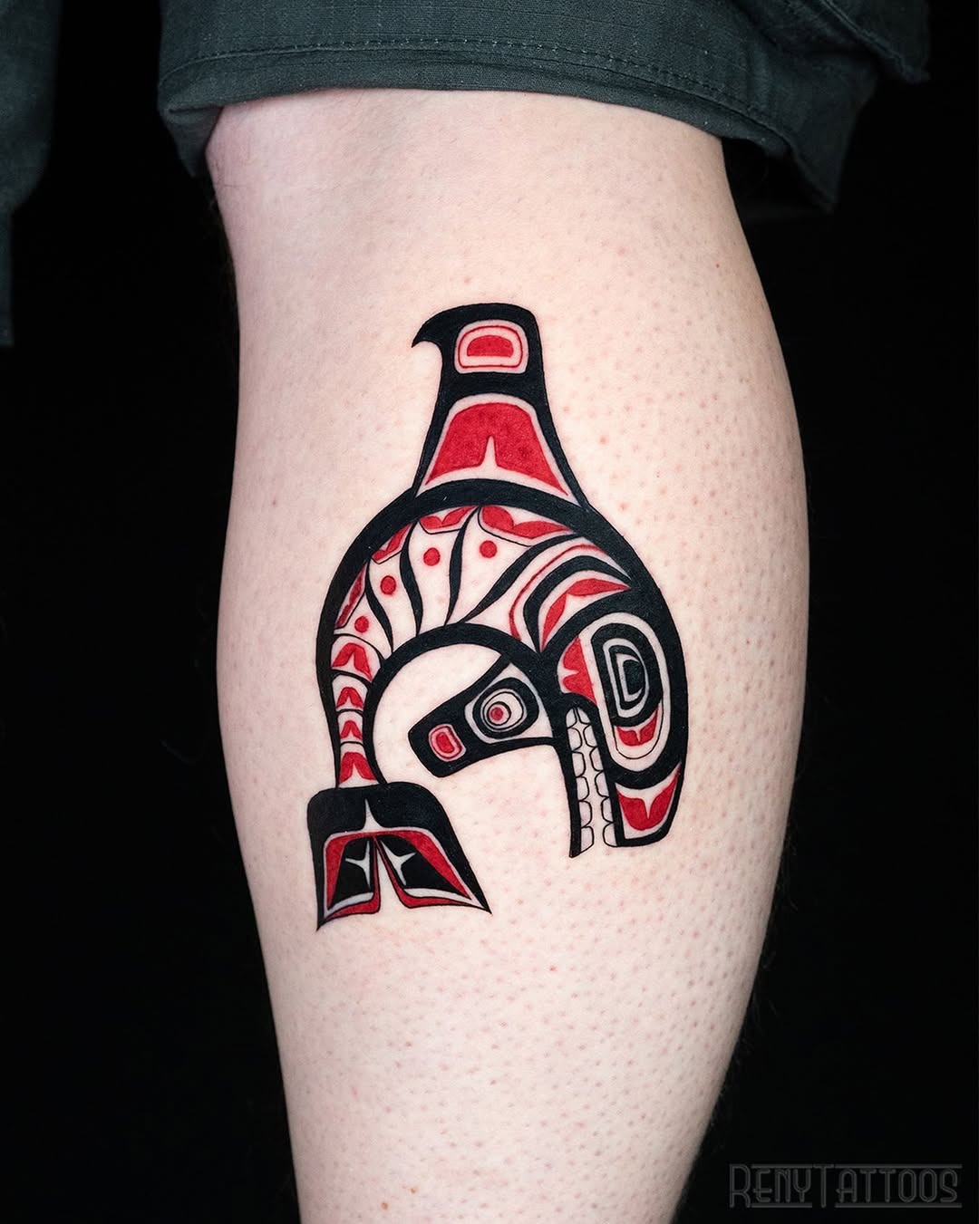 Striking tribal whale tattoo with bold colors Tattoo Design