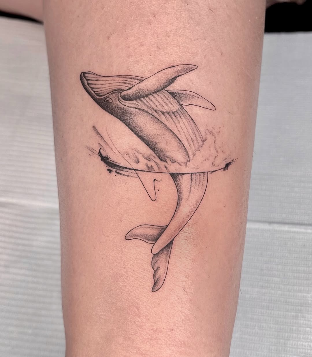 Stunning minimalist whale tattoo in motion Tattoo Design