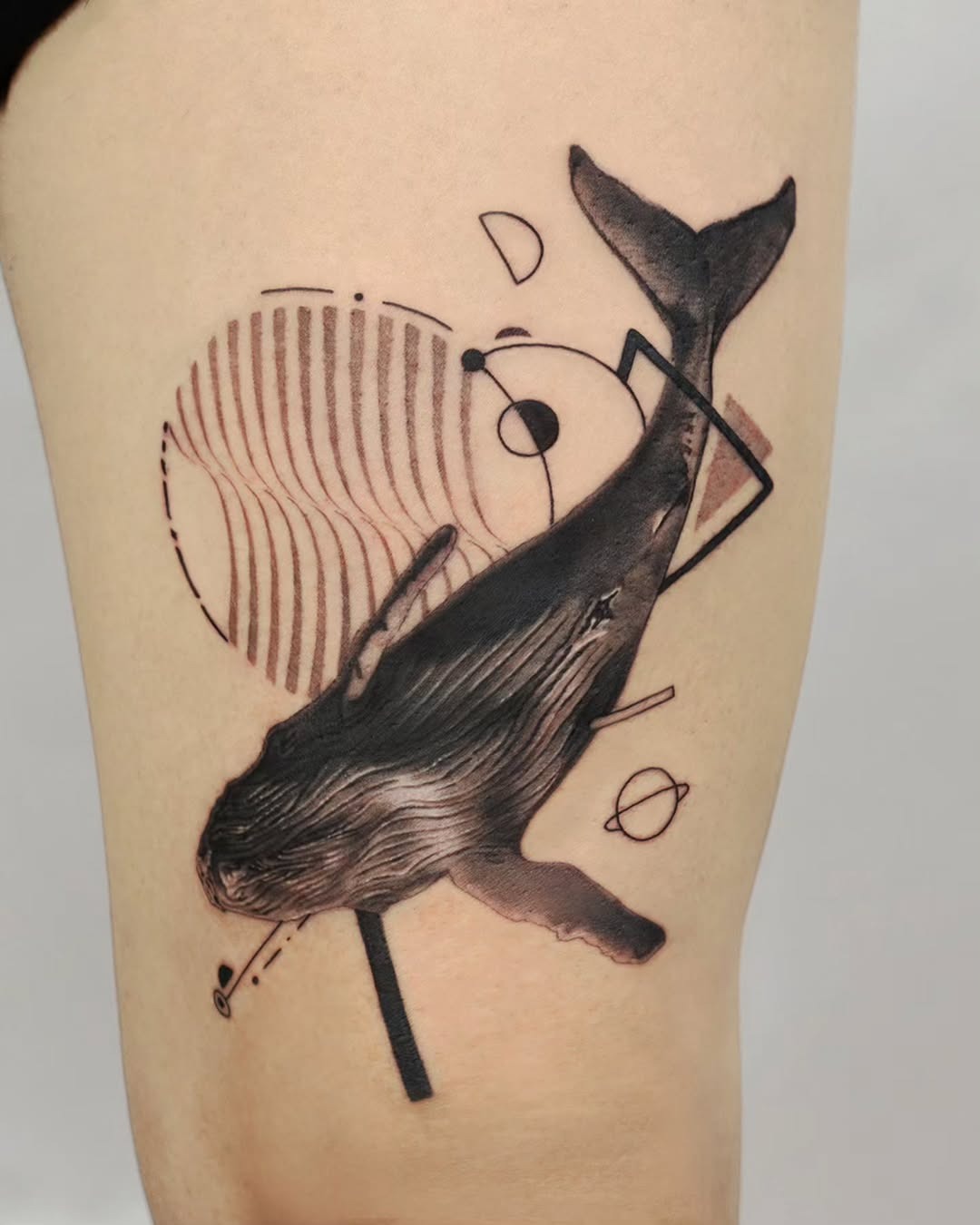 Stunning Minimalist Whale Tattoo with Abstract Elements Tattoo Design