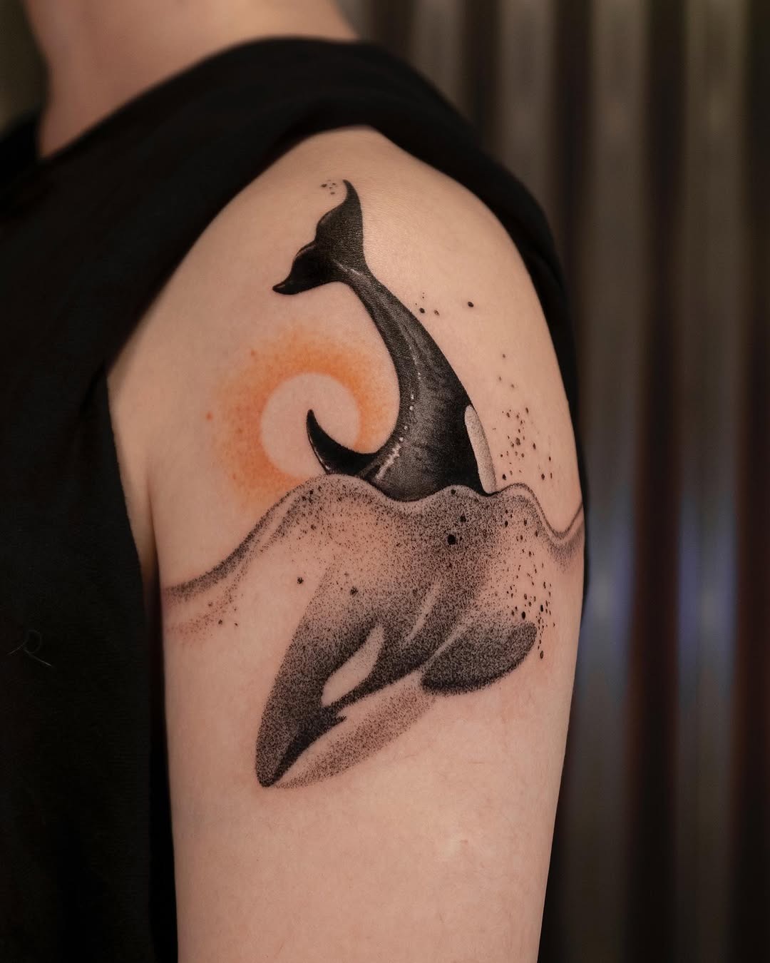 Stunning Orca Tattoo with Minimalist Waves Tattoo Design