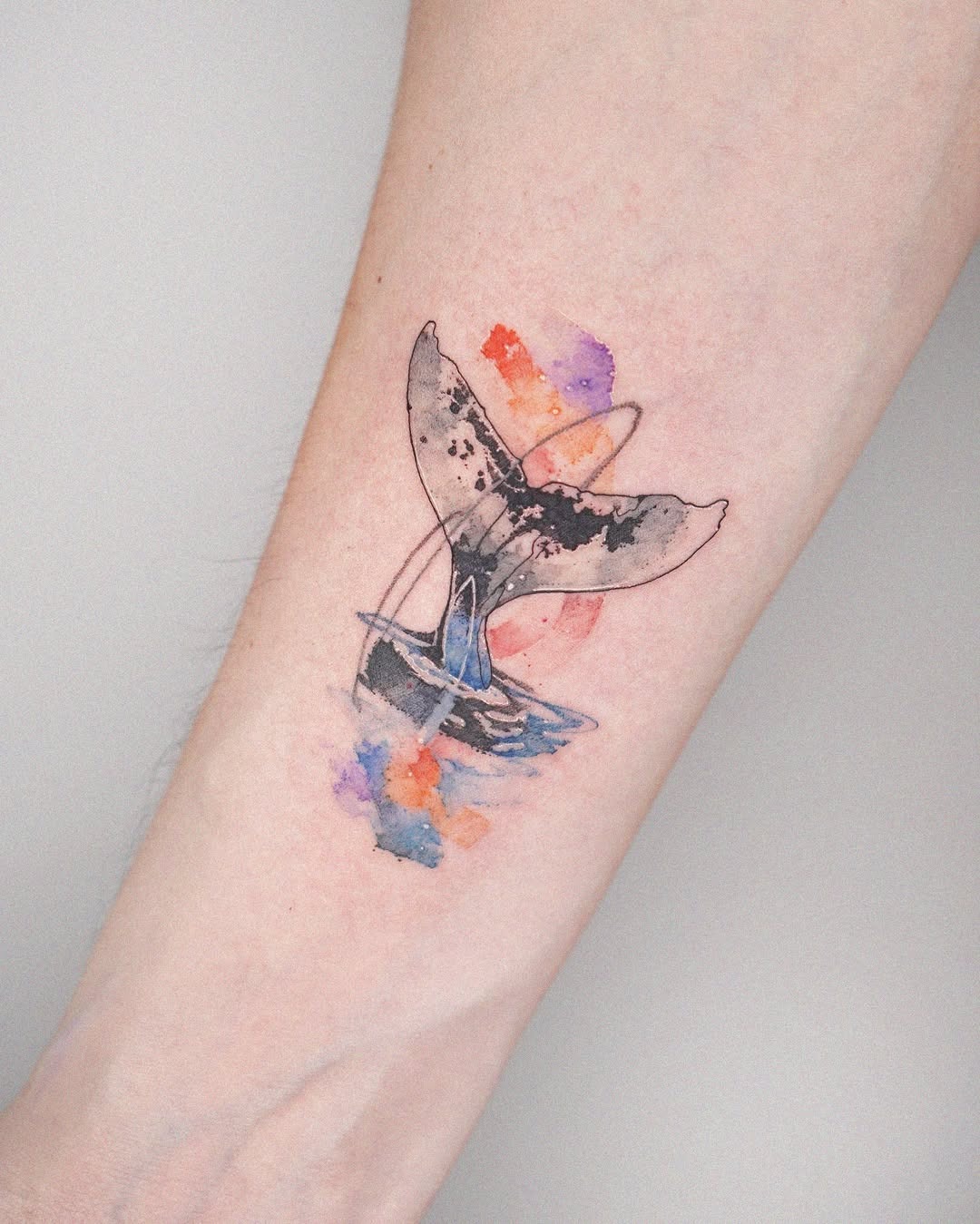 Stunning Watercolor Whale Tattoo on Arm Tattoo Design