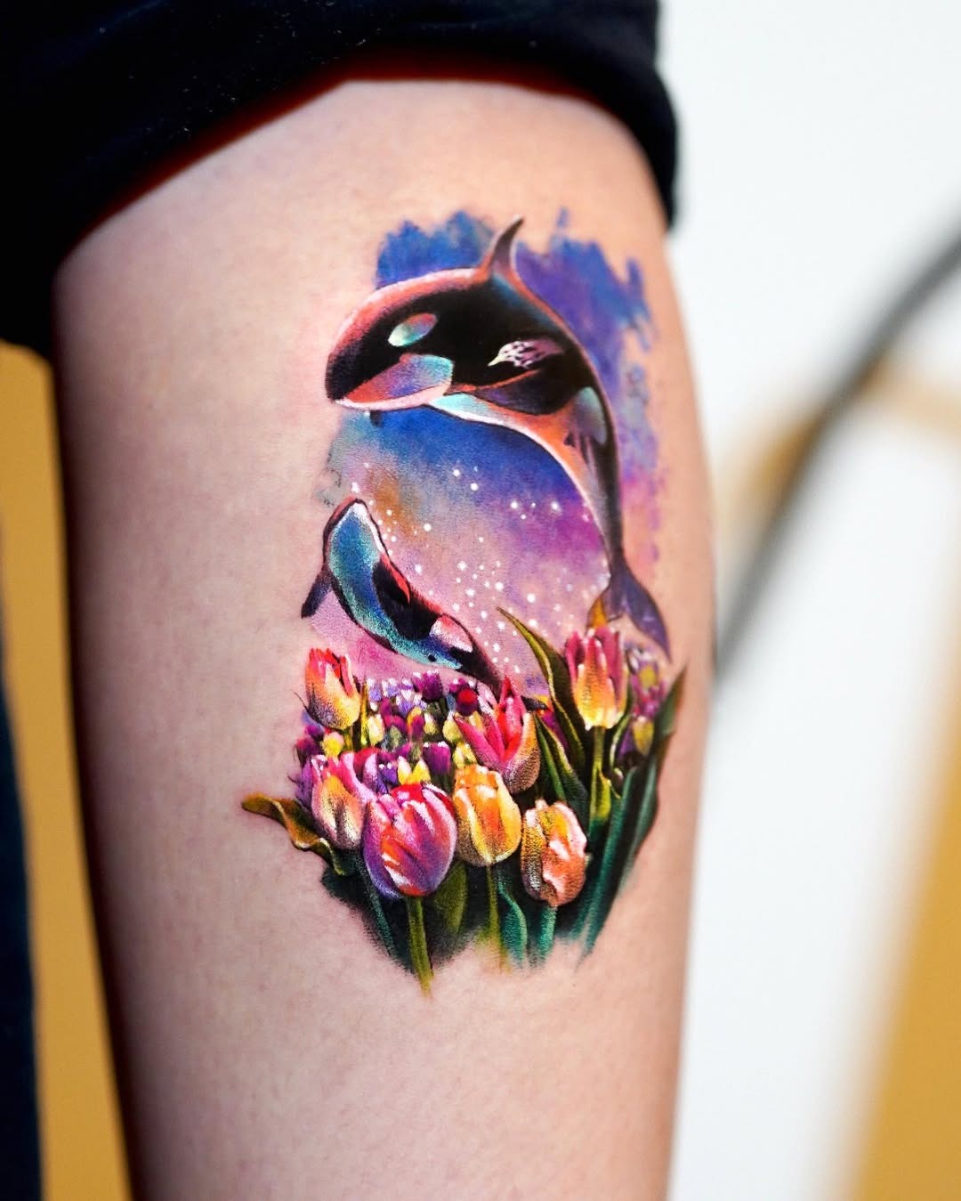 Vibrant Orca Tattoo Surrounded by Flowers Tattoo Design