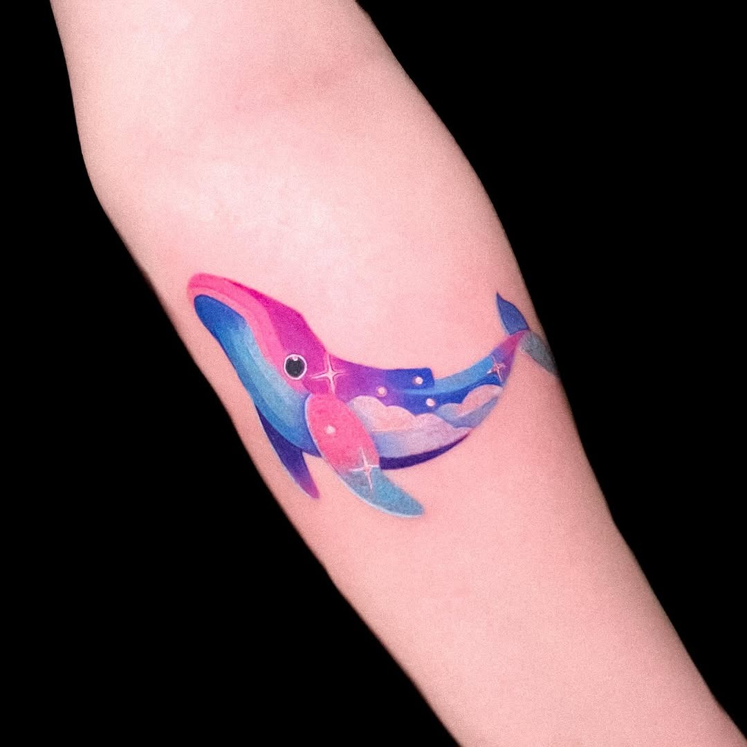 Vibrant whale tattoo with cosmic elements Tattoo Design