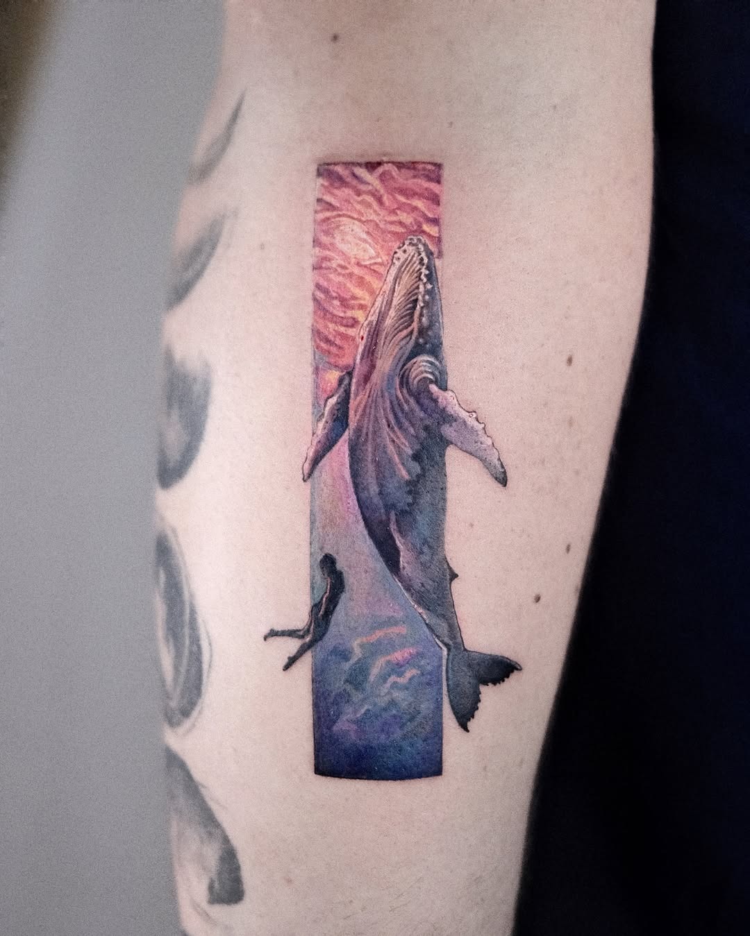 Vibrant whale tattoo with dreamy ocean backdrop Tattoo Design