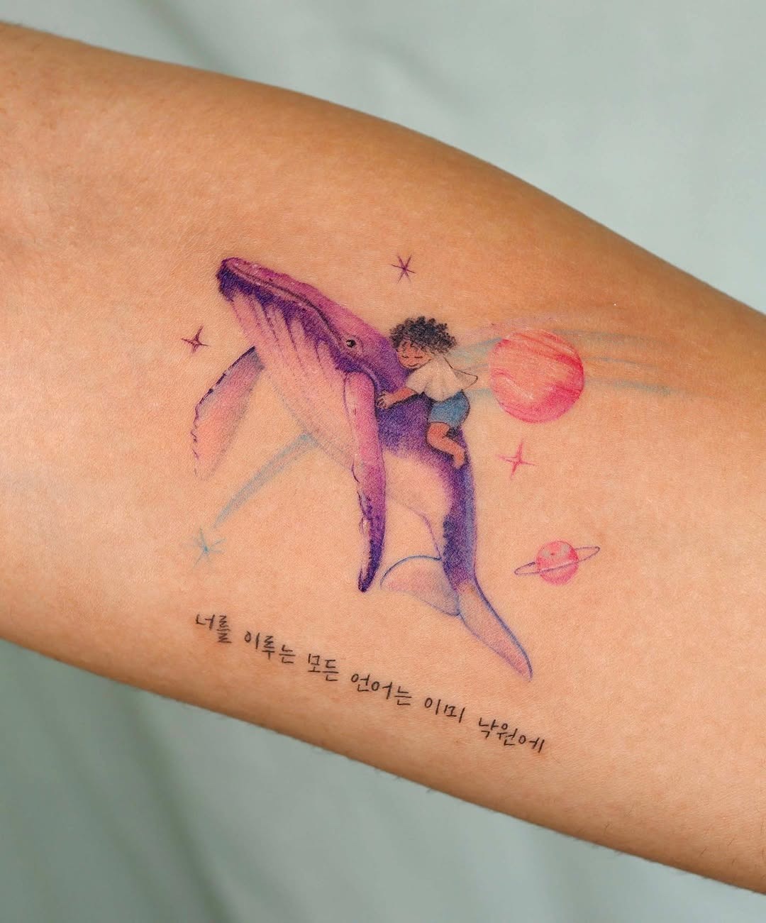 Whimsical Whale Tattoo with Child and Planets Tattoo Design