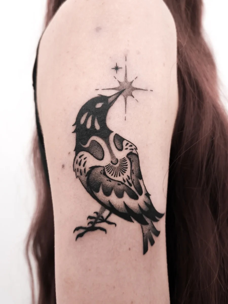 A stunning whimsical bird tattoo shining bright Tattoo Design