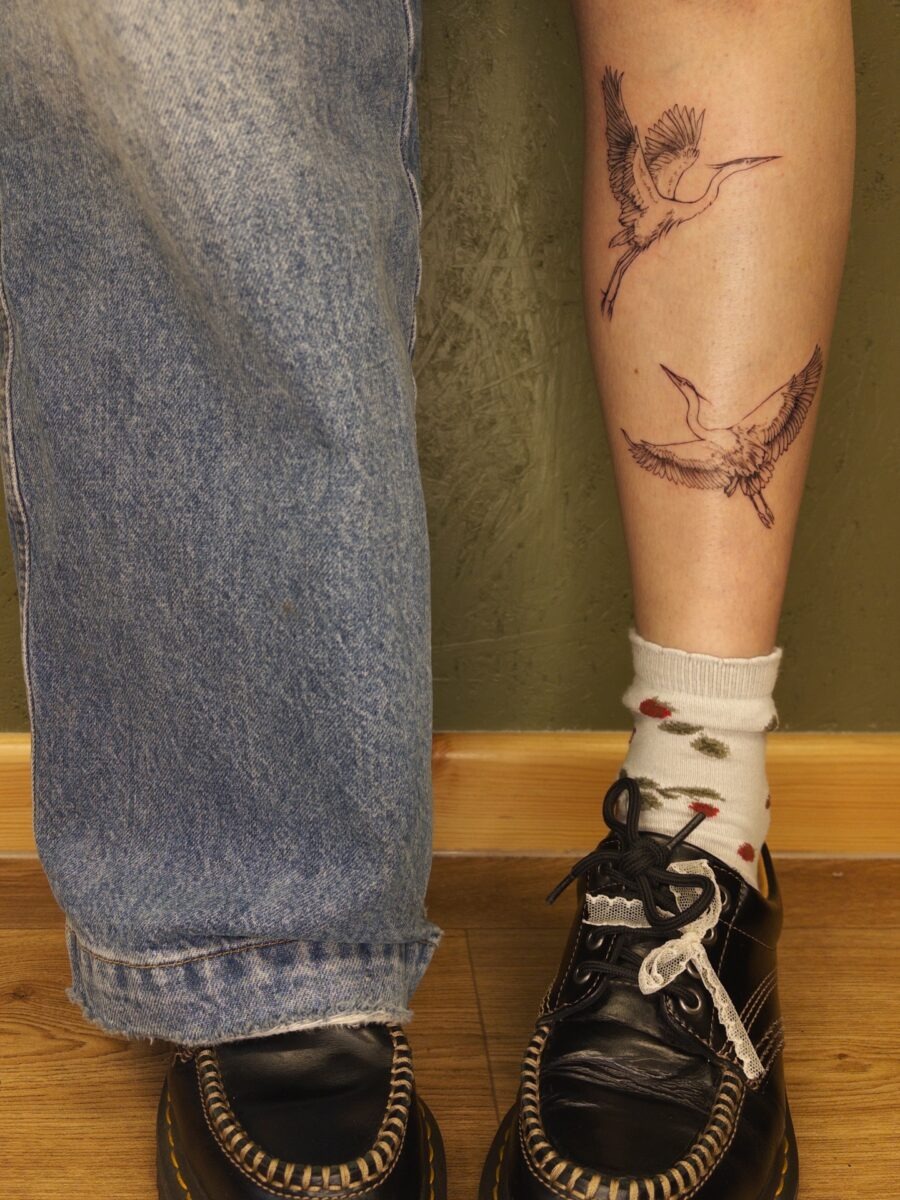 Bird tattoos add a whimsical flair to legs Tattoo Design