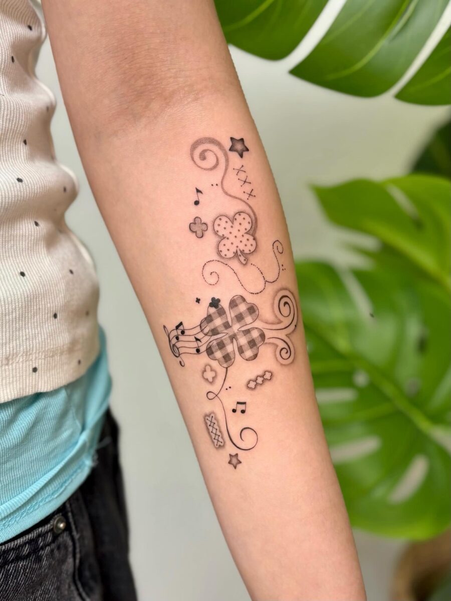 Charming and whimsical floral music tattoo Tattoo Design