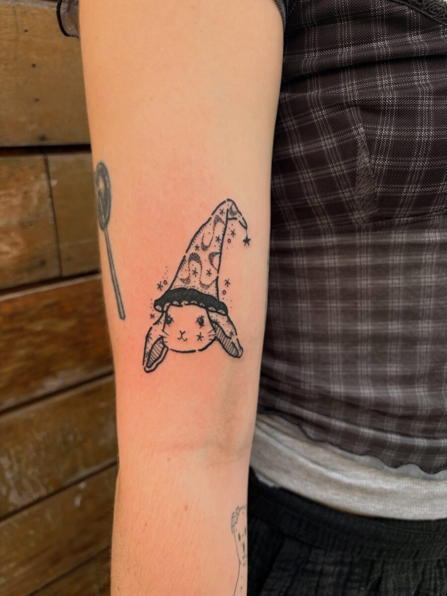 Charming bunny donning wizard hat design Tattoo Design