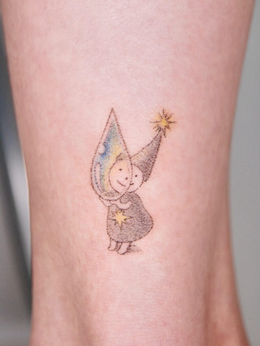 Charming fairy tattoo with playful colors Tattoo Design