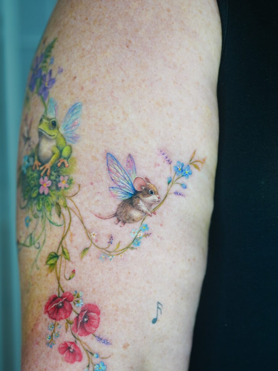 Charming frogs and mice in vibrant nature scene Tattoo Design