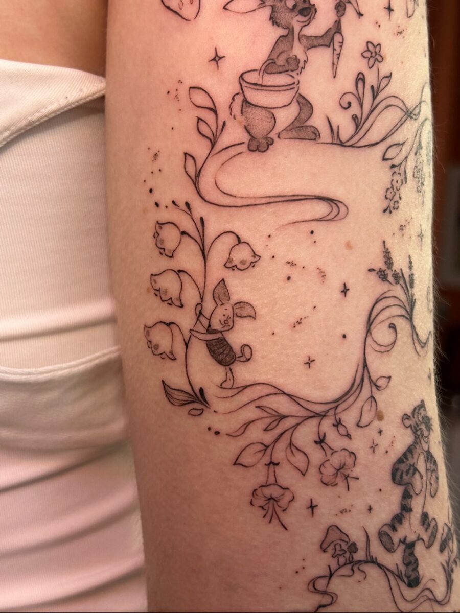Charming Tattoos Featuring Playful Animals and Flora Tattoo Design