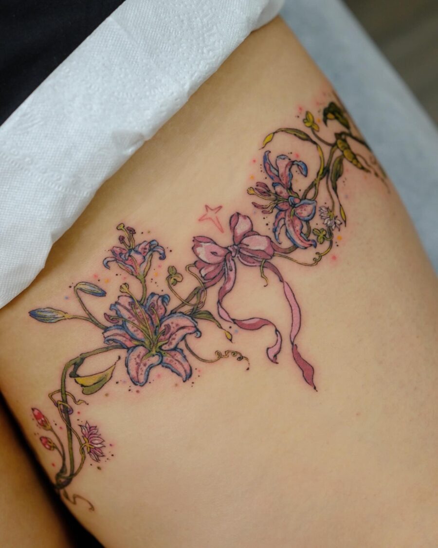 Delicate floral tattoos with playful ribbons Tattoo Design