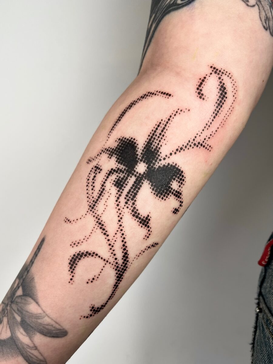 Intricate dotwork forming a whimsical floral design Tattoo Design