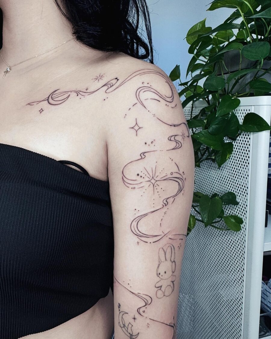 Magical swirls and playful characters adorn skin. Tattoo Design