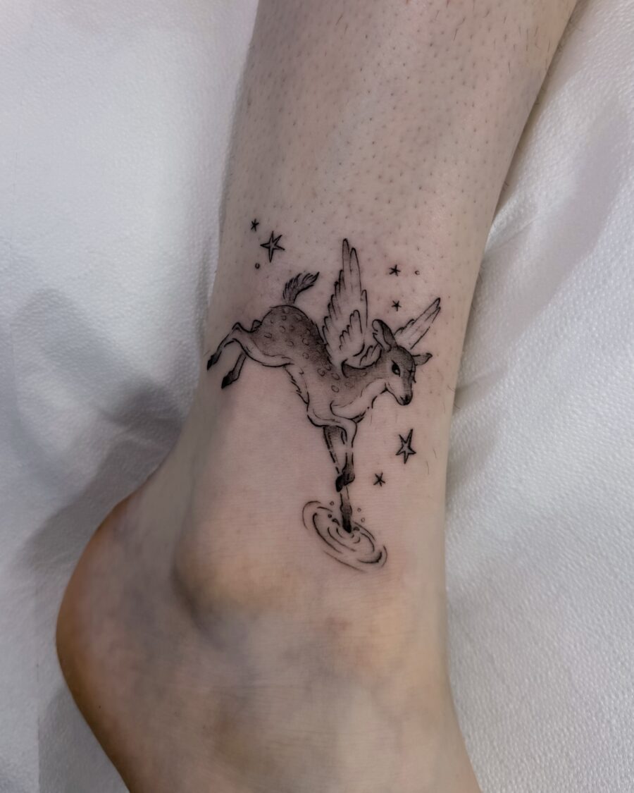 Magical unicorn tattoo with playful details Tattoo Design