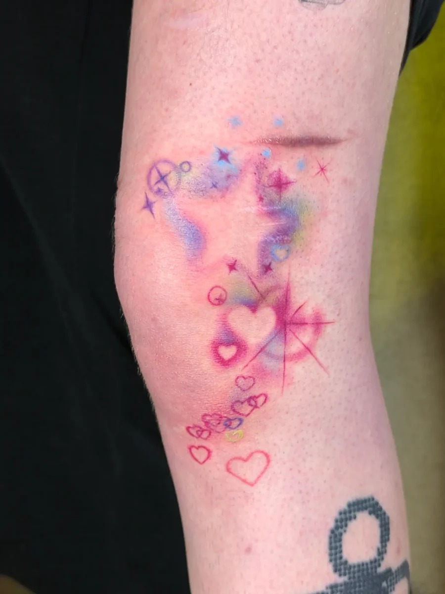 Playful hearts and vibrant sparkles unite here Tattoo Design