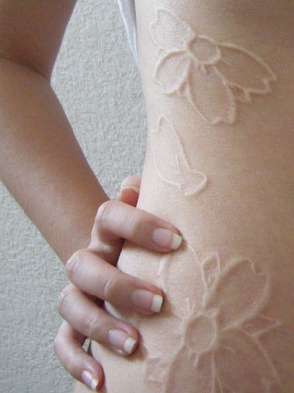 Cascading Flowers in a Subtle Hue White Ink Tattoo Tattoo Design